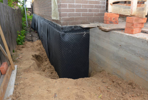 Happy homeowners after waterproofing job in Malvern